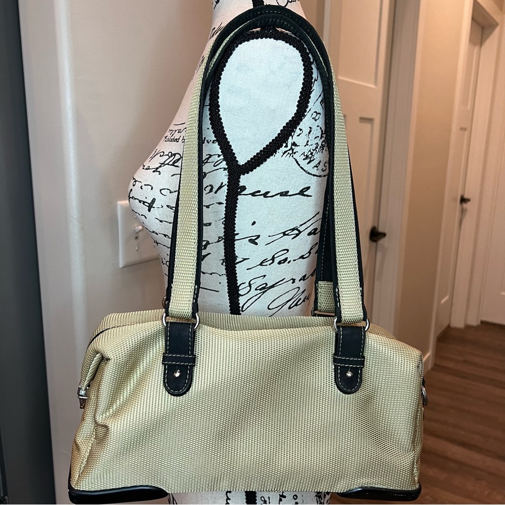 The Sak Tan and Brown Rectangular Purse. Woven in durable materials.